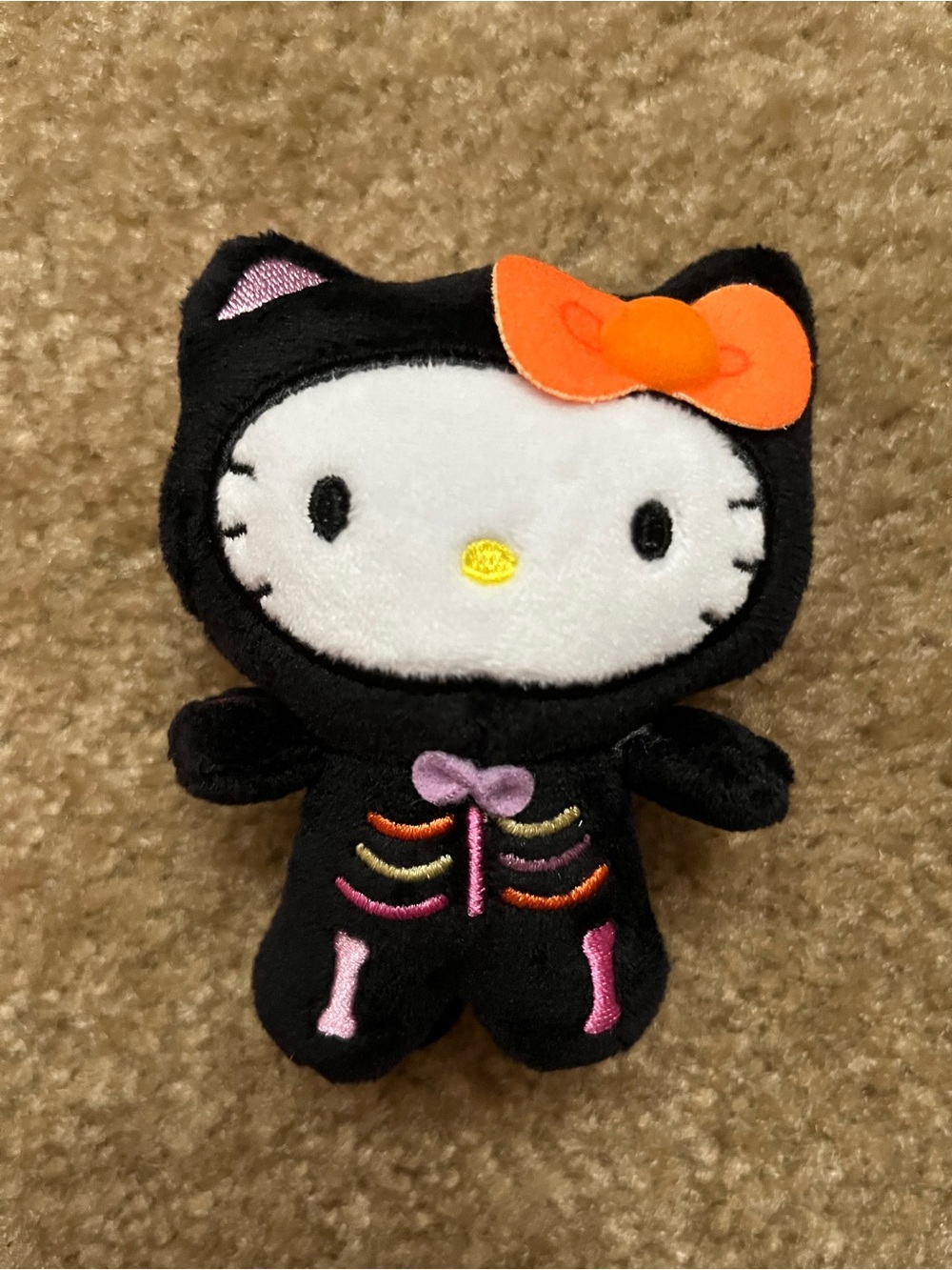 Viral Hello Kitty Black Skeleton Plush Dangler with Orange Bow and Pink Accents